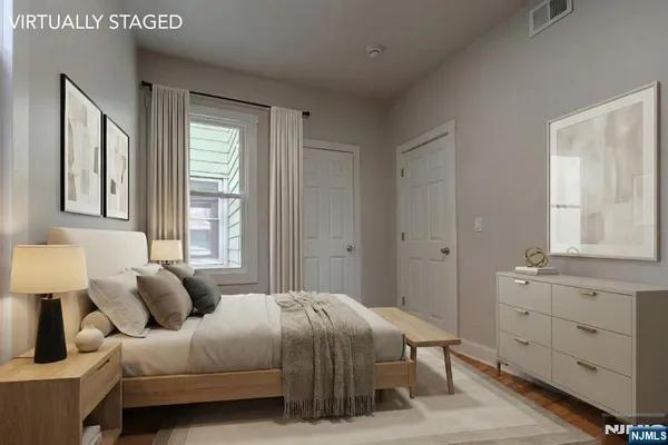 a bedroom with a bed and window