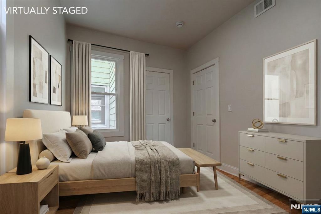 882 South 14th Street, Unit 2 Newark, NJ 07108 - Photo 6 of 18 a bedroom with a bed and window