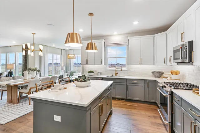 a kitchen with a sink stove and cabinets