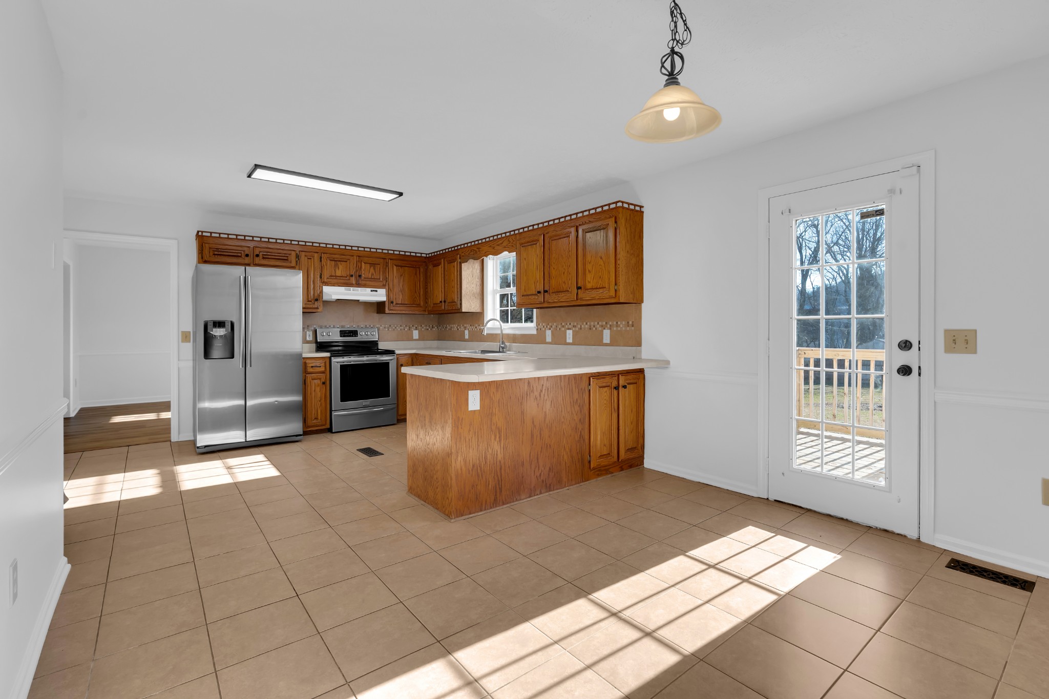 113 Matt Drive Bell Buckle, TN 37020 - Photo 16 of 34 a kitchen with stainless steel appliances granite countertop a stove a sink and a refrigerator