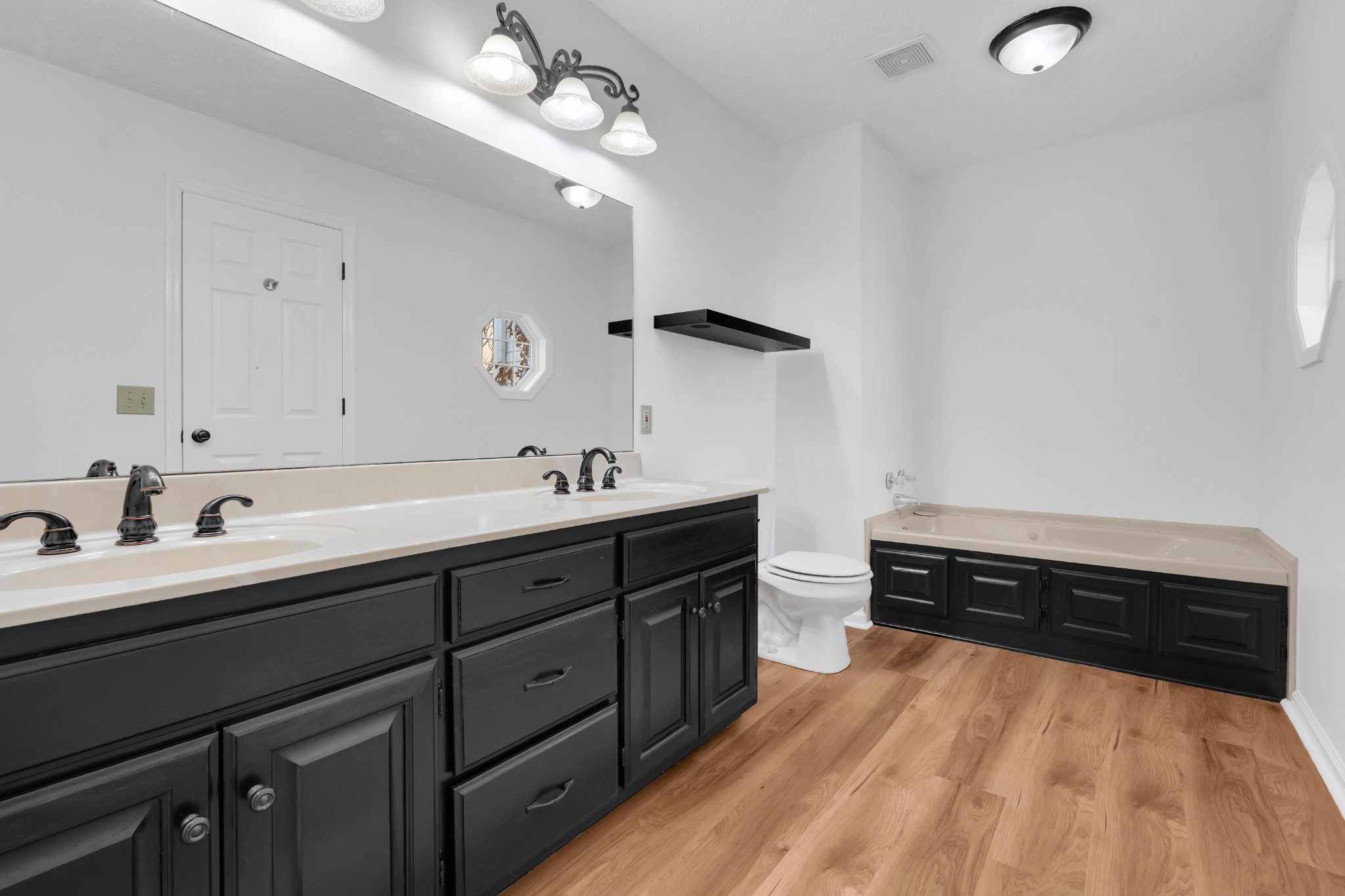 113 Matt Drive Bell Buckle, TN 37020 - Photo 24 of 34 a spacious bathroom with a double vanity sink and a mirror