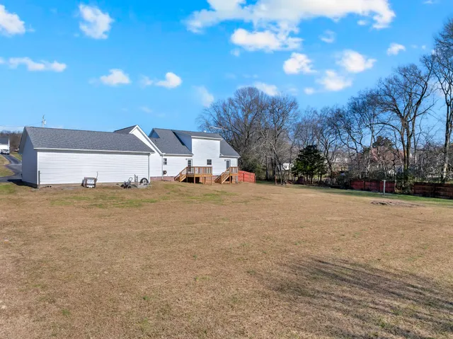a view of road with large trees