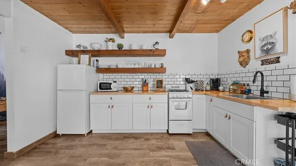 a kitchen with stainless steel appliances granite countertop a stove and a sink