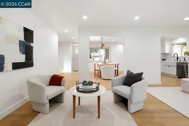 a living room with furniture and a table