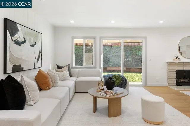 a living room with furniture and a large window