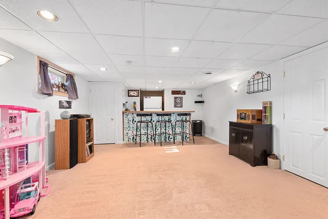 a bed room with a bed and a book shelf
