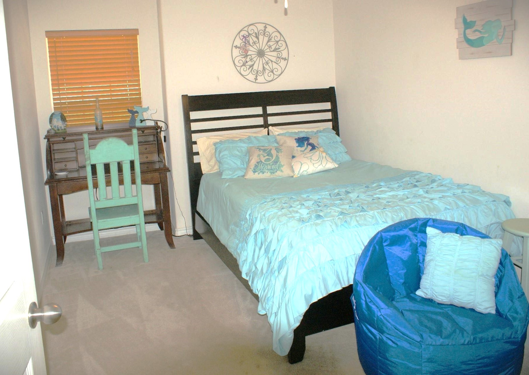 231 Memphis Belle Trinity, TX 75862 - Photo 32 of 47 a bed sitting in a bedroom next to a window