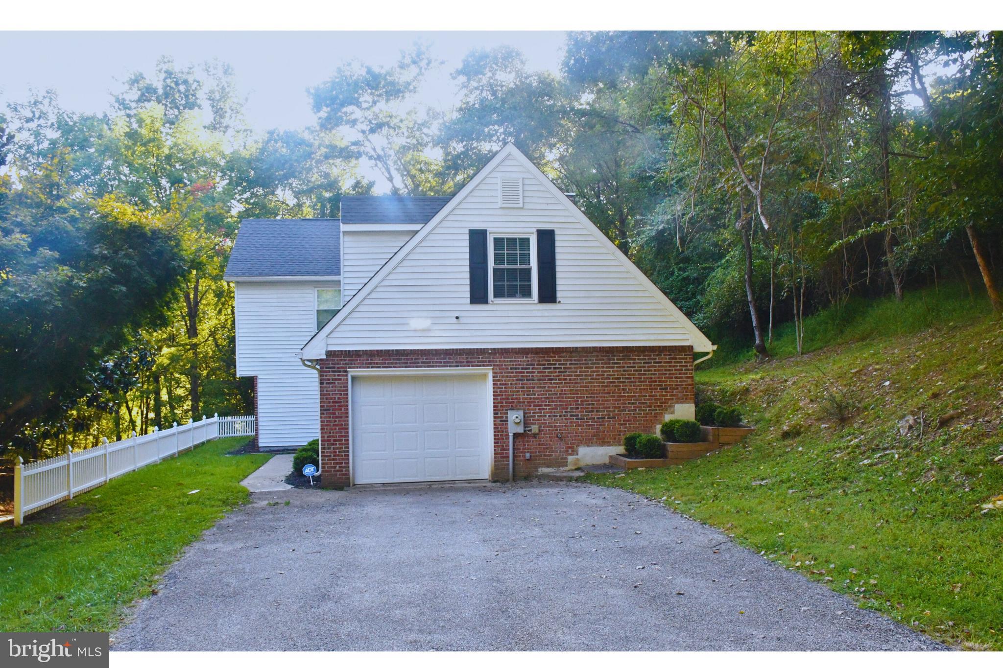 17930 Masemore Road Parkton, MD 21120 - Photo 43 of 46 a front view of house with yard and trees in the background