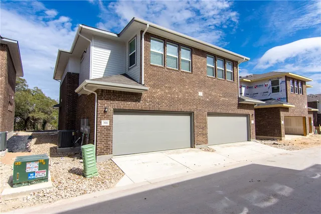 a front view of a house with yard