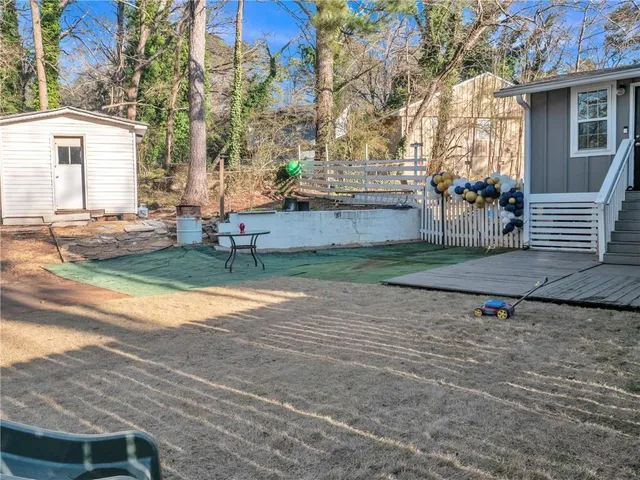 an empty room with windows and cabinet