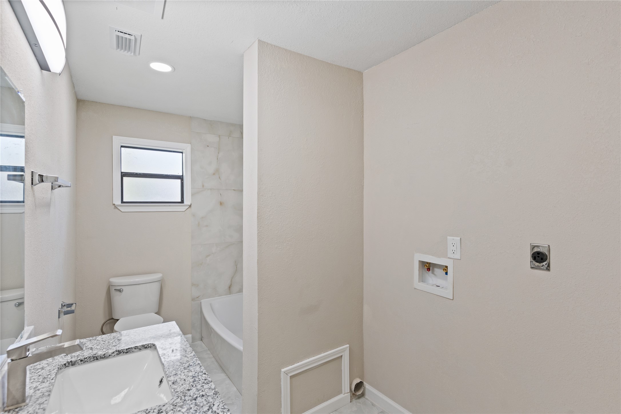 10613 Chadwick Street Houston, TX 77029 - Photo 18 of 30 a bathroom with a sink and a toilet