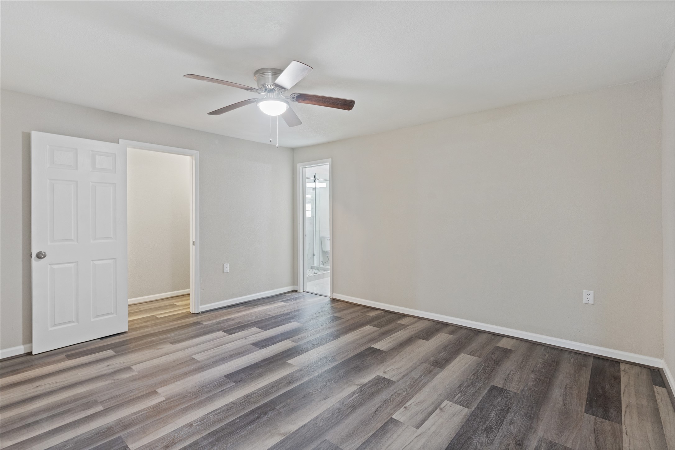 10613 Chadwick Street Houston, TX 77029 - Photo 19 of 30 a view of an empty room with wooden floor
