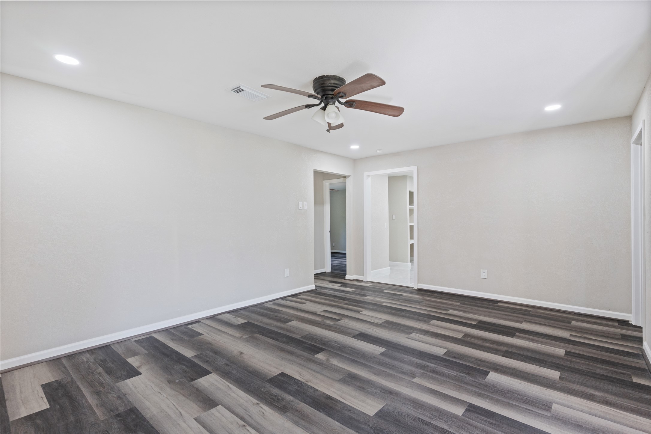 10613 Chadwick Street Houston, TX 77029 - Photo 10 of 30 a view of a room with a ceiling fan