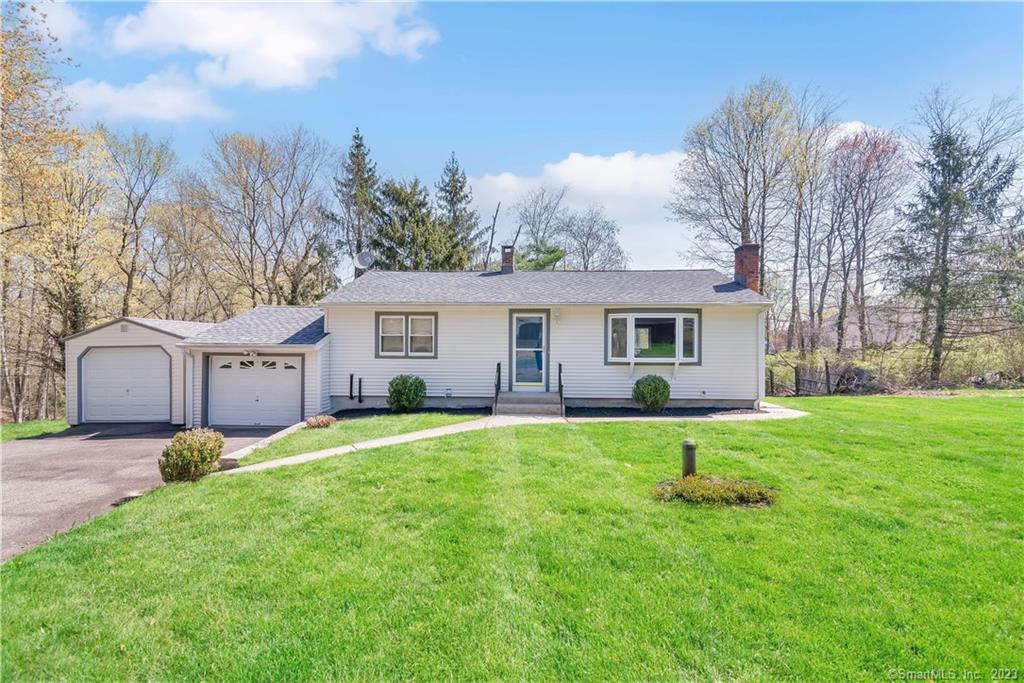 12 Joy Road Middlebury, CT 06762 - Photo 1 of 1 a front view of house with yard and green space