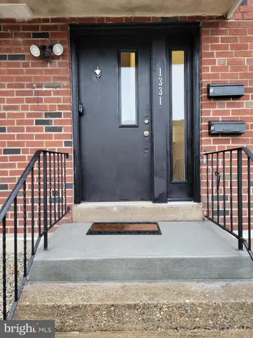 a view of a brick house with wooden floor