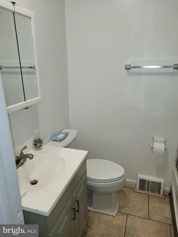 a bathroom with a glass door shower