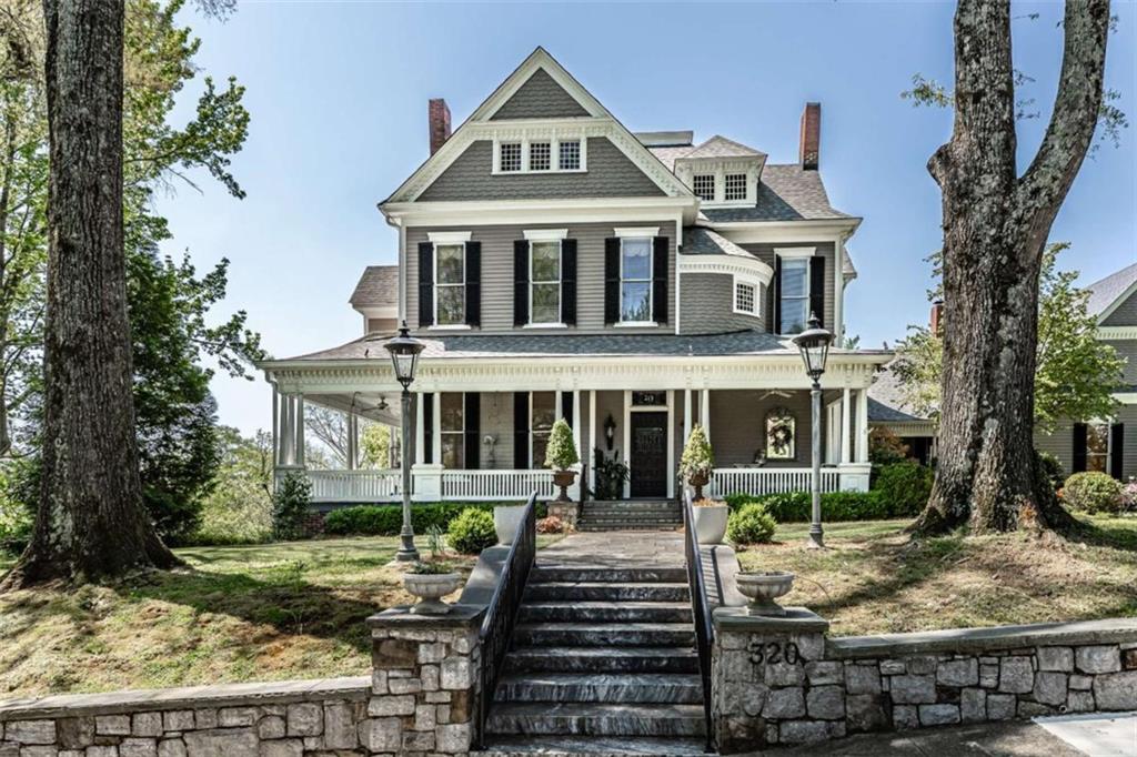 a front view of a house with garden