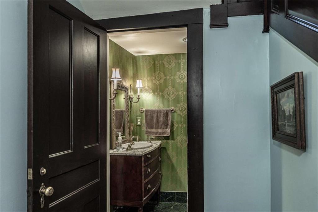 320 East 3rd Avenue Rome, GA 30161 - Photo 38 of 94 a bathroom with a mirror sink and glass door