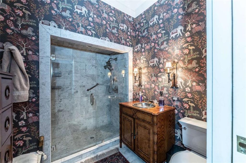 320 East 3rd Avenue Rome, GA 30161 - Photo 54 of 94 a bathroom with a toilet and a shower curtain