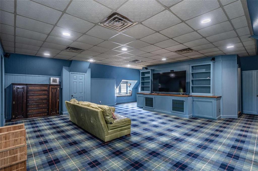 320 East 3rd Avenue Rome, GA 30161 - Photo 61 of 94 a living room with furniture a flat screen tv and kitchen view