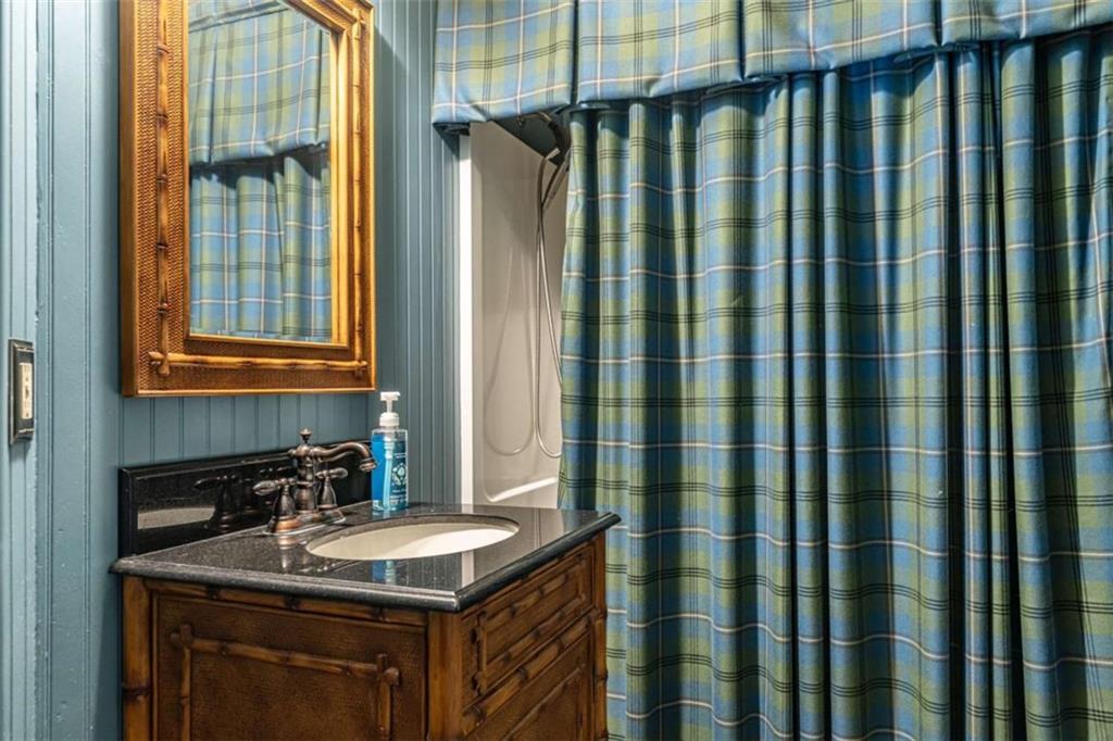 320 East 3rd Avenue Rome, GA 30161 - Photo 64 of 94 a bathroom with a granite countertop sink and a mirror