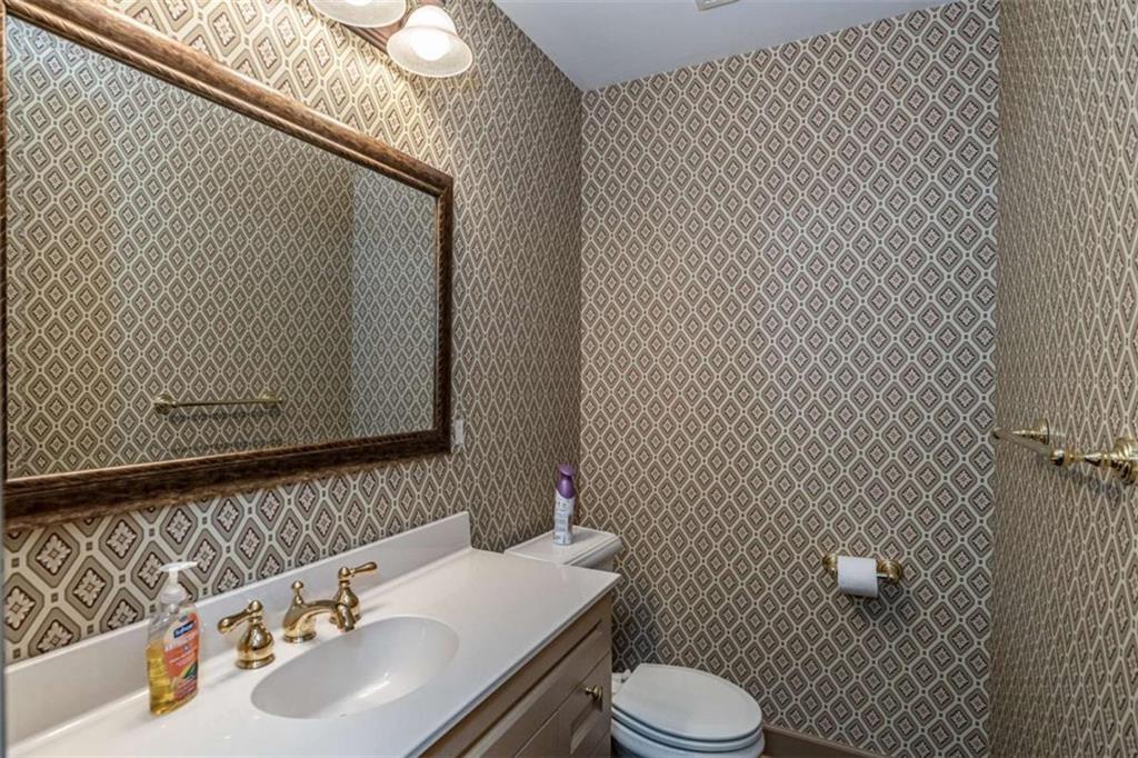 320 East 3rd Avenue Rome, GA 30161 - Photo 77 of 94 a bathroom with a sink toilet and mirror