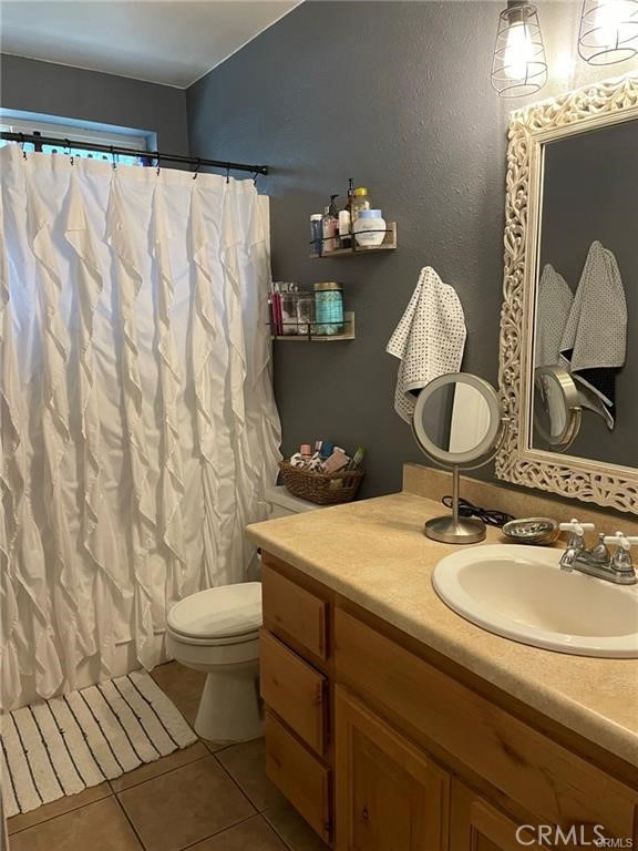 14508 Colter Way Magalia, CA 95954 - Photo 2 of 11 a bathroom with a sink a toilet and a mirror