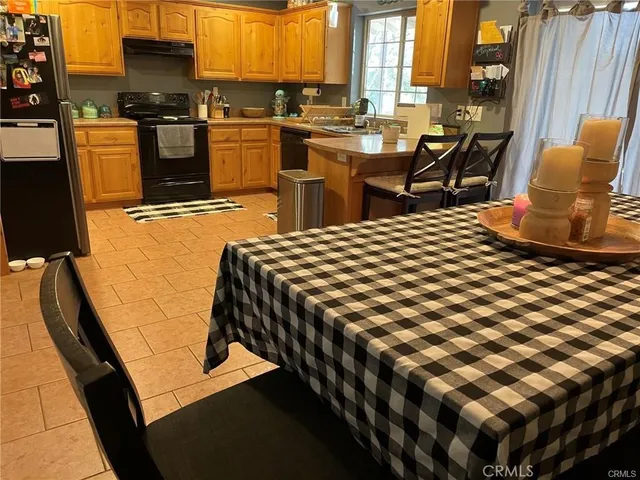 a kitchen with a sink and a stove top oven