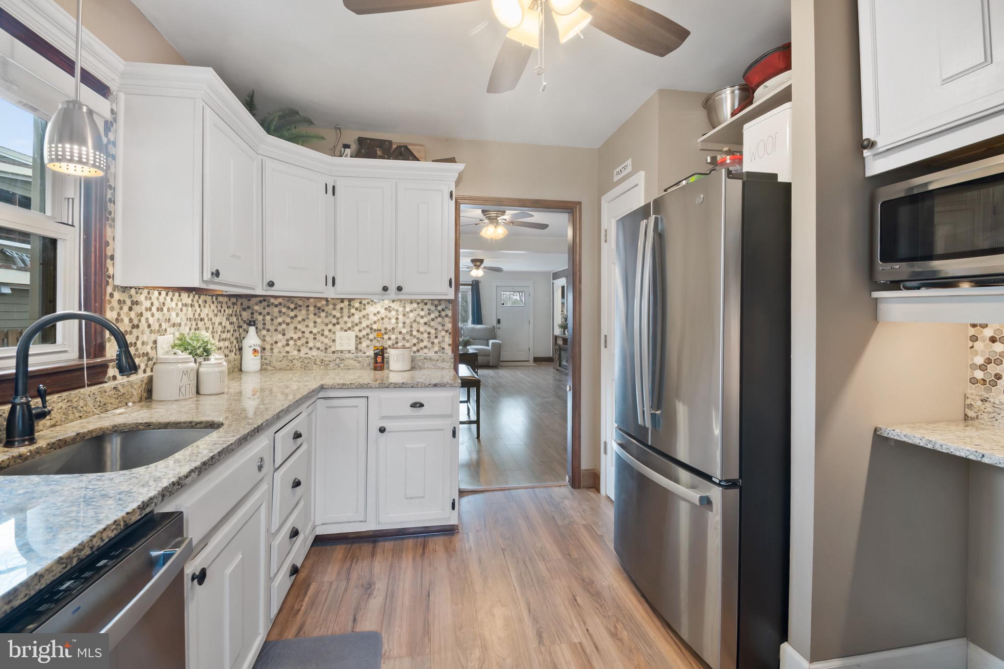 10520 Scaggsville Road Laurel, MD 20723 - Photo 11 of 32 a kitchen with a refrigerator sink and microwave