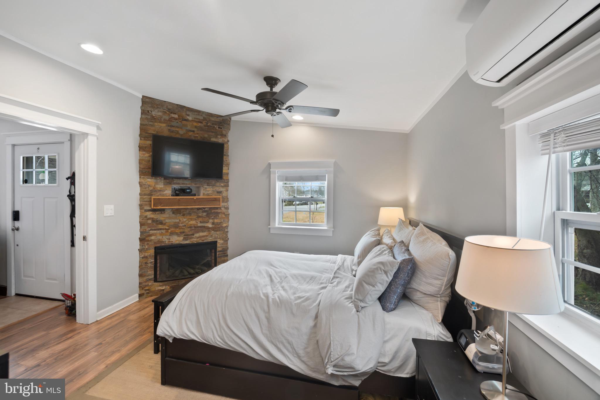 10520 Scaggsville Road Laurel, MD 20723 - Photo 13 of 32 a bedroom with a bed and a flat screen tv