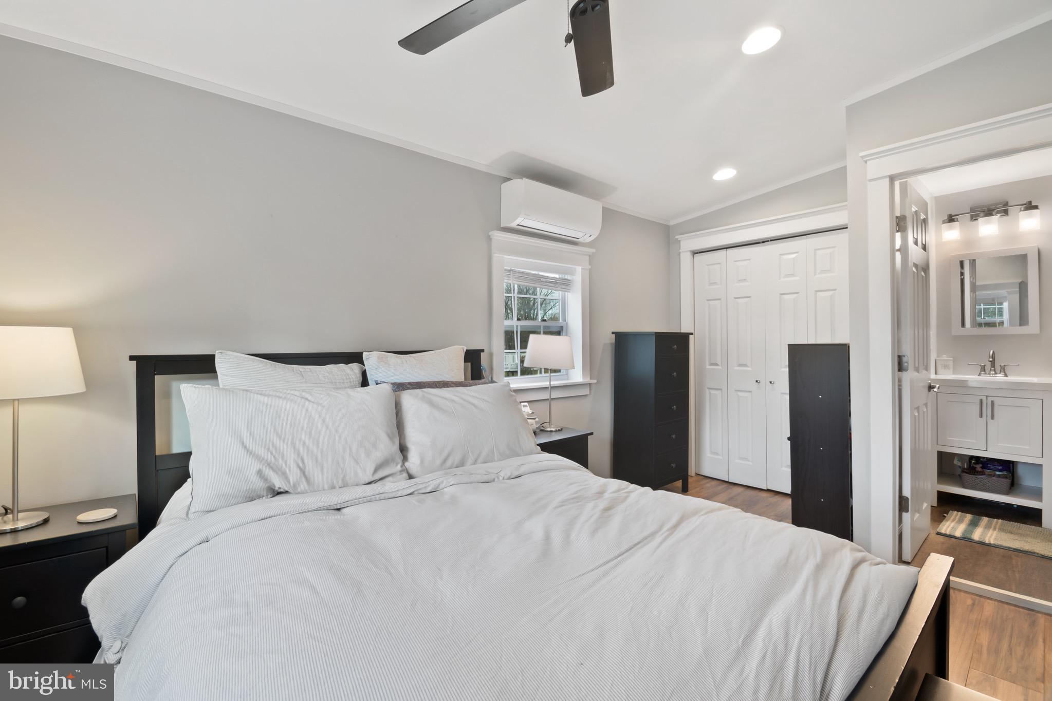 10520 Scaggsville Road Laurel, MD 20723 - Photo 14 of 32 a bedroom with a bed and a walk in closet