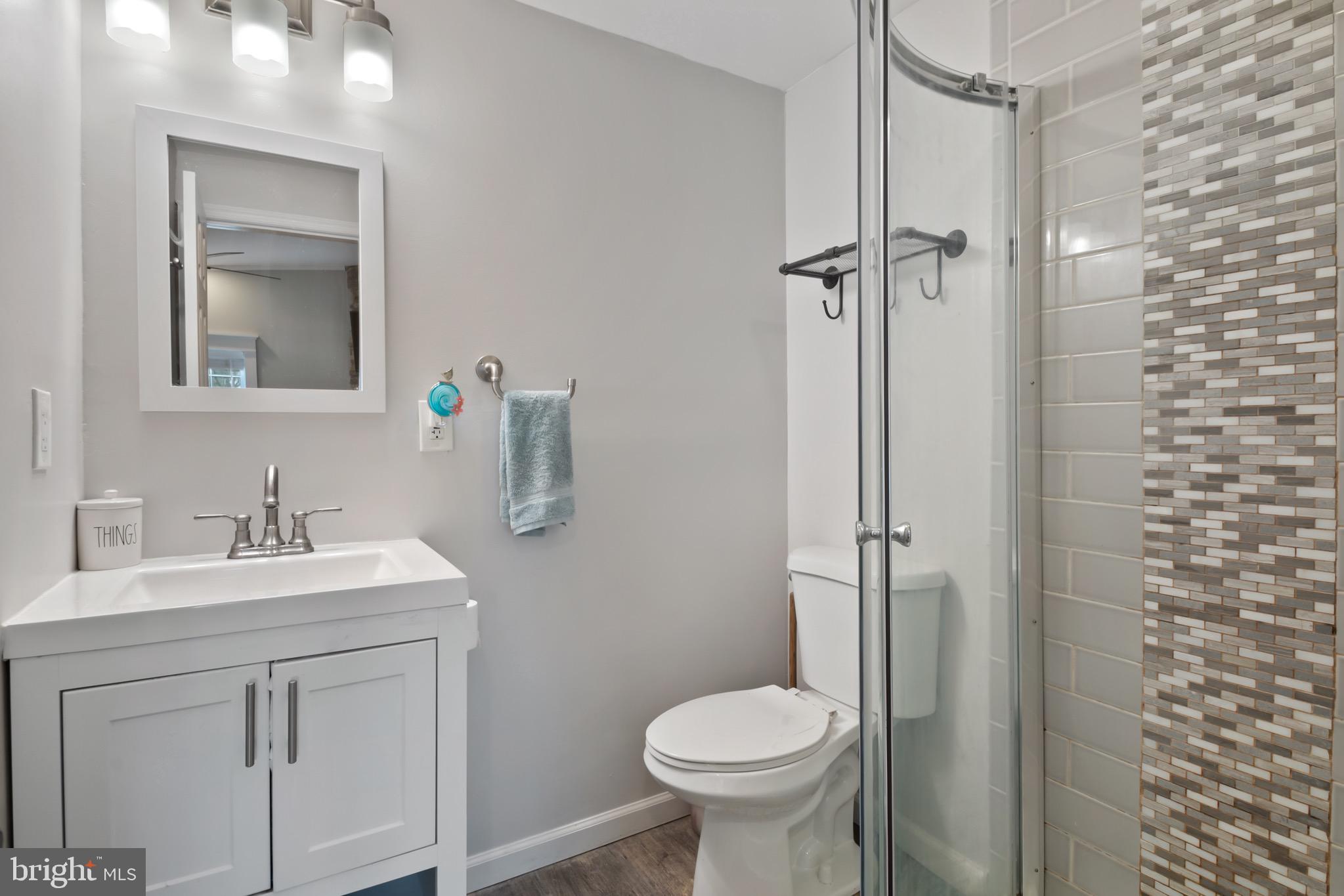 10520 Scaggsville Road Laurel, MD 20723 - Photo 15 of 32 a bathroom with a sink toilet and shower