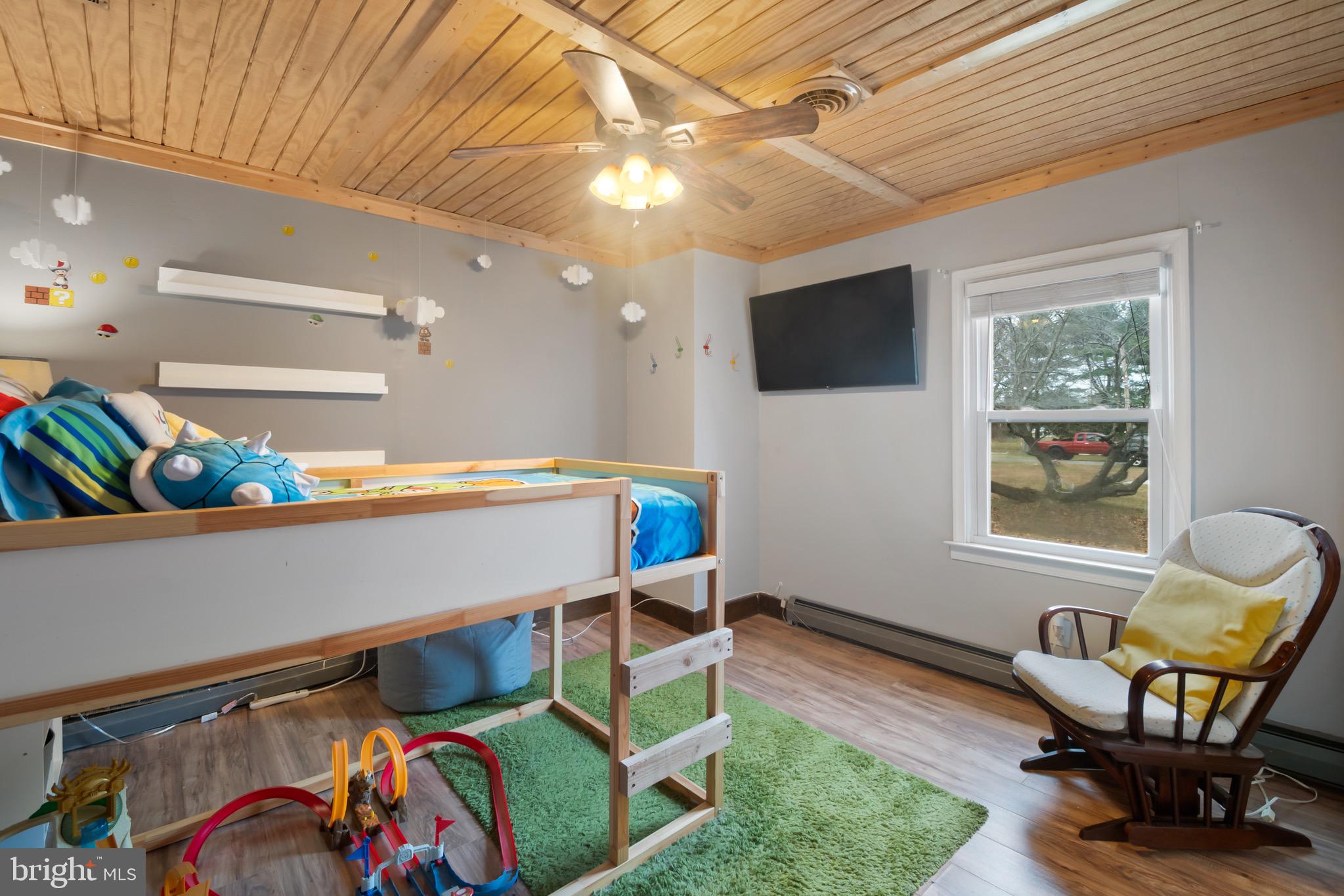 10520 Scaggsville Road Laurel, MD 20723 - Photo 16 of 32 a living room with furniture and a flat screen tv