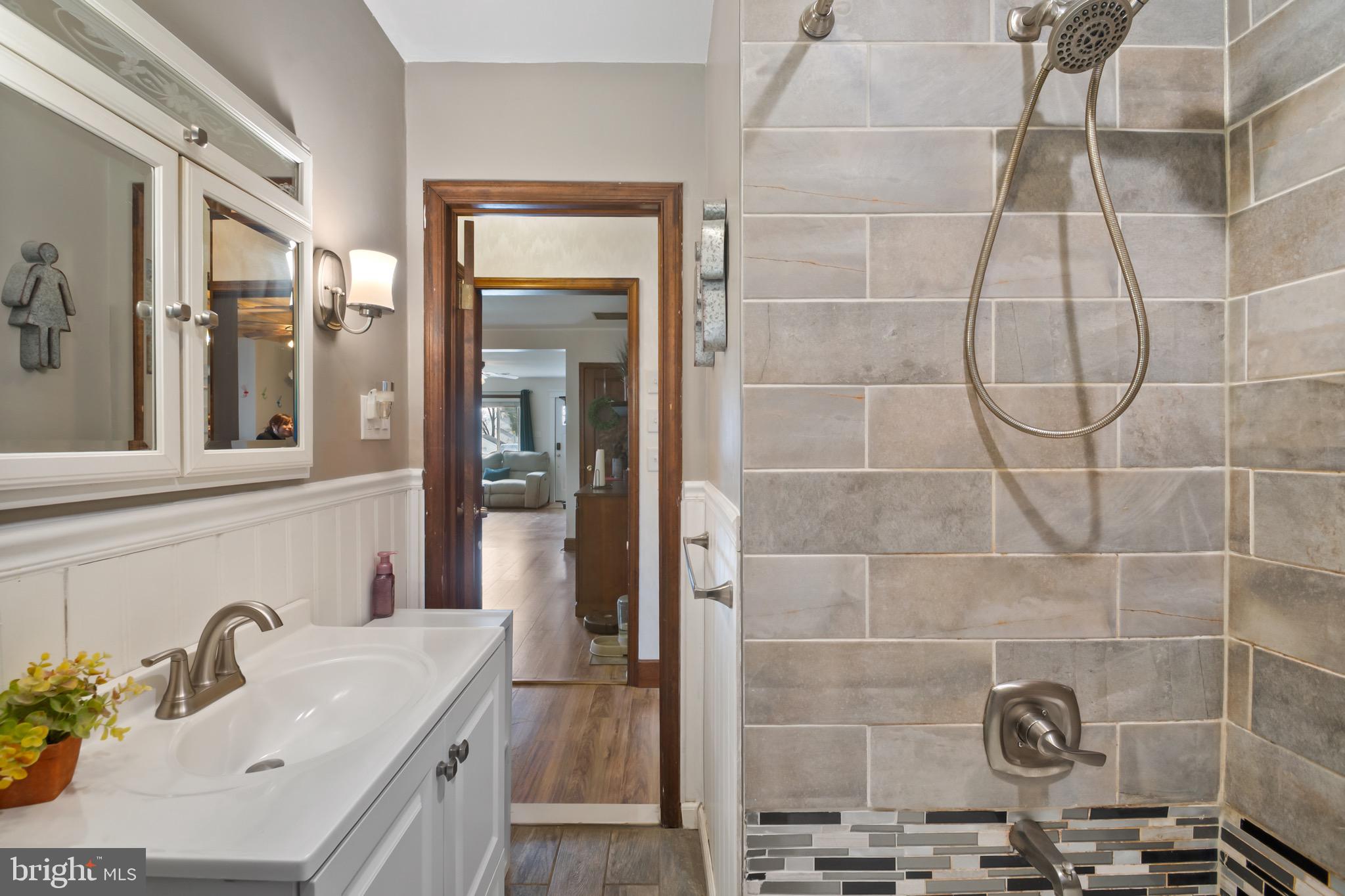 10520 Scaggsville Road Laurel, MD 20723 - Photo 19 of 32 a bathroom with a sink and a shower