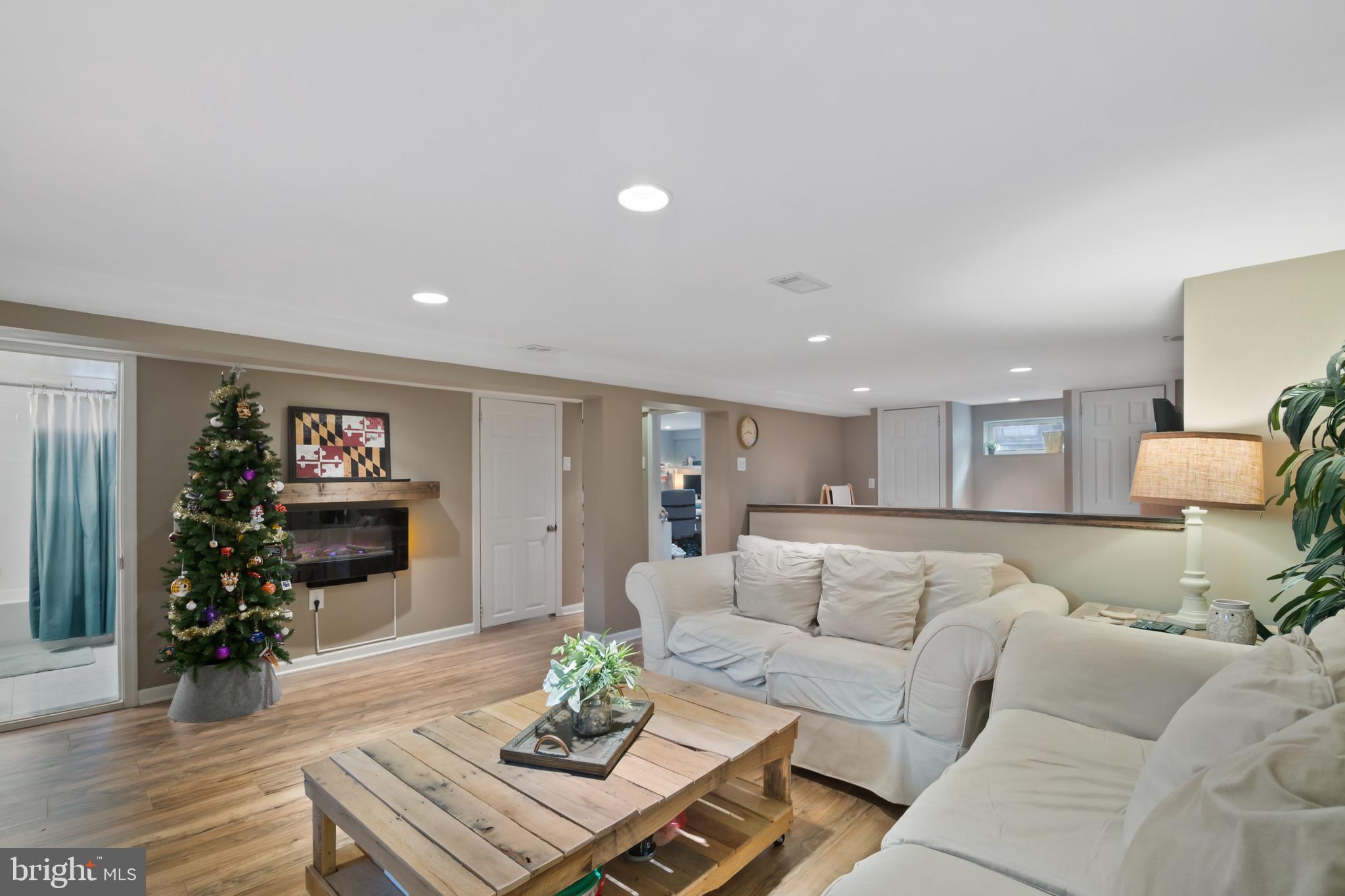 10520 Scaggsville Road Laurel, MD 20723 - Photo 24 of 32 a living room with furniture and wooden floor