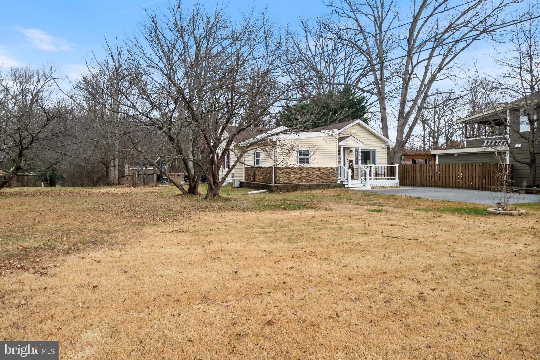10520 Scaggsville Road Laurel, MD 20723 - Photo 3 of 32 a front view of a house with a yard covered with snow