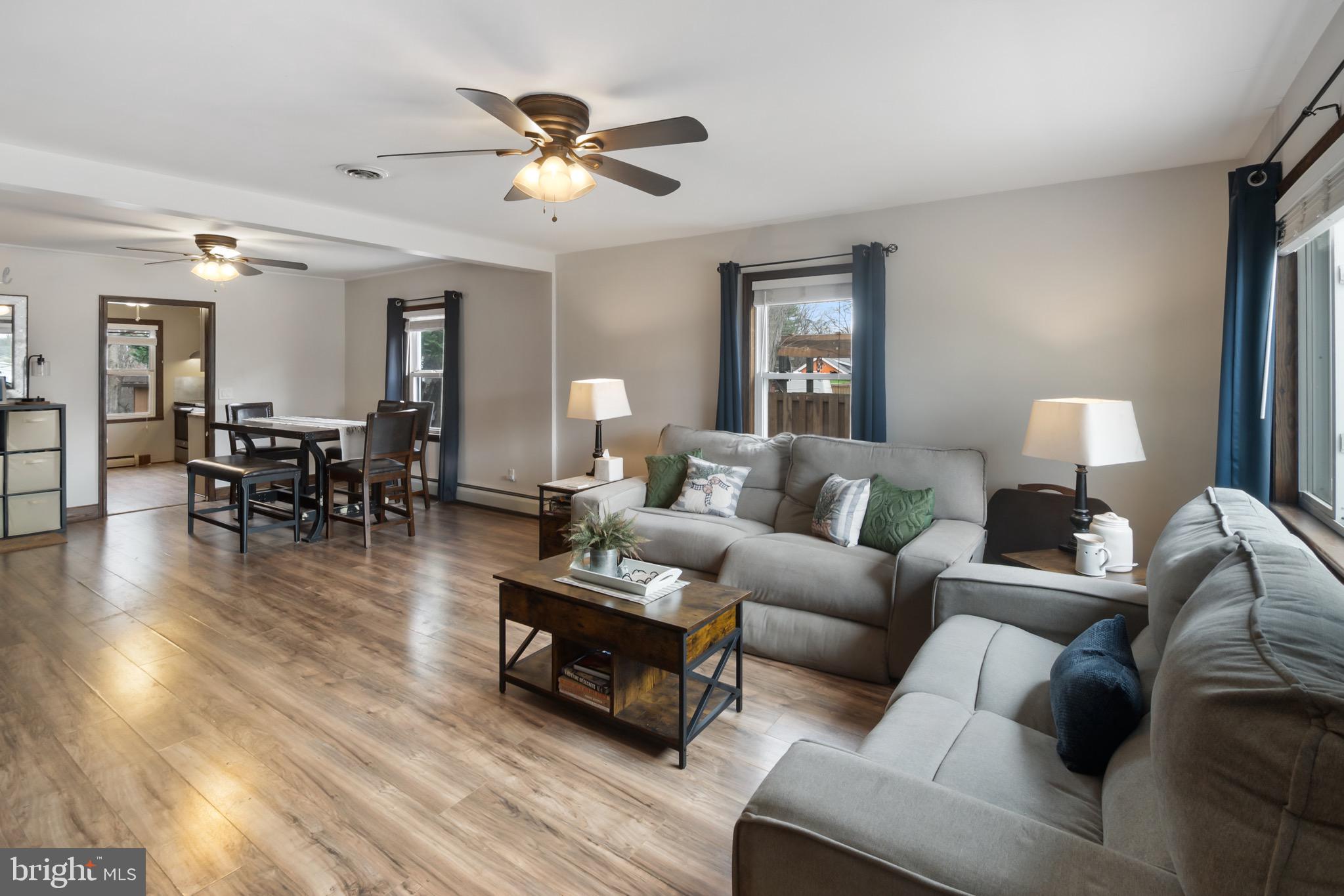 10520 Scaggsville Road Laurel, MD 20723 - Photo 5 of 32 a living room with furniture and a wooden floor