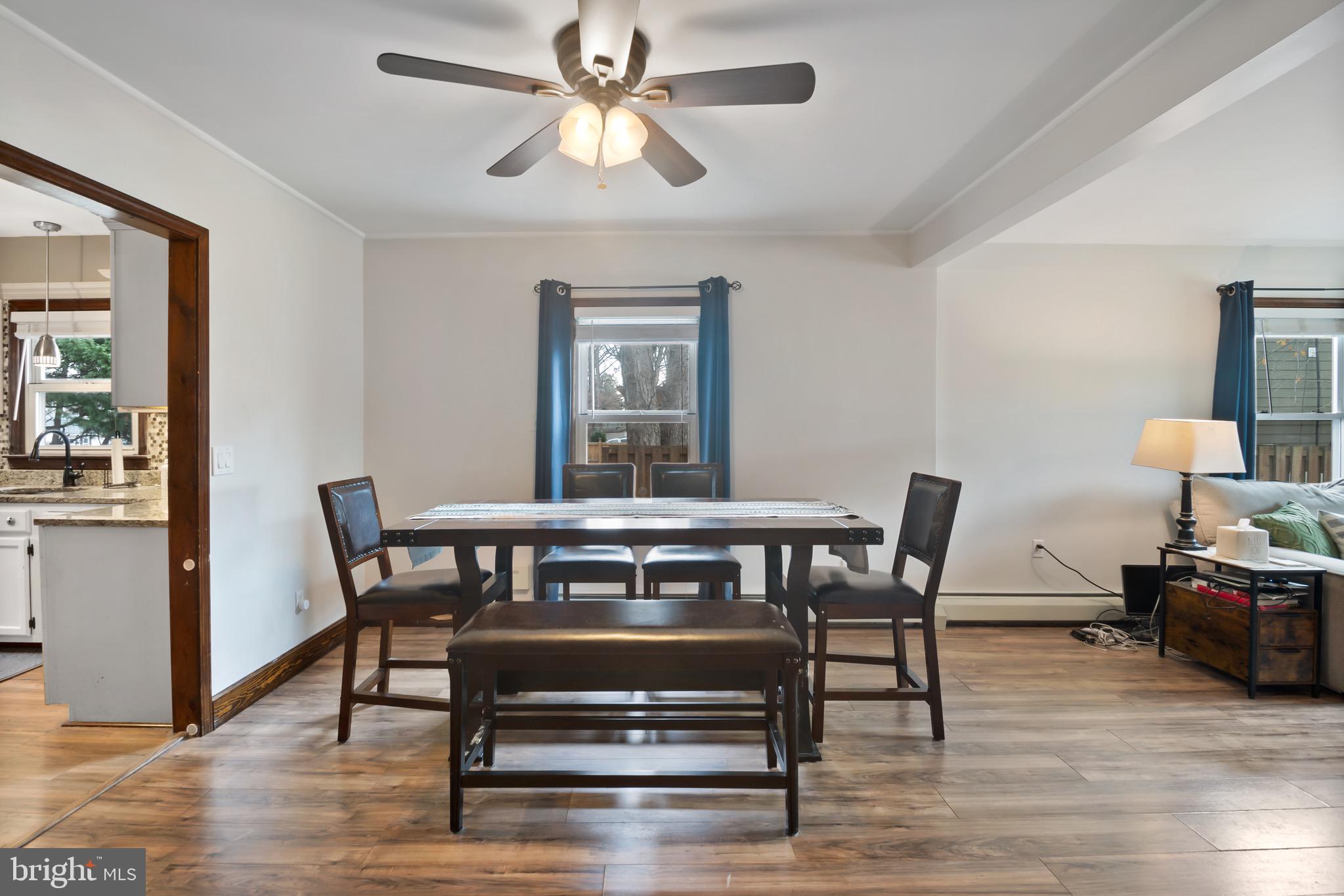 10520 Scaggsville Road Laurel, MD 20723 - Photo 8 of 32 a view of a dining room with furniture and wooden floor