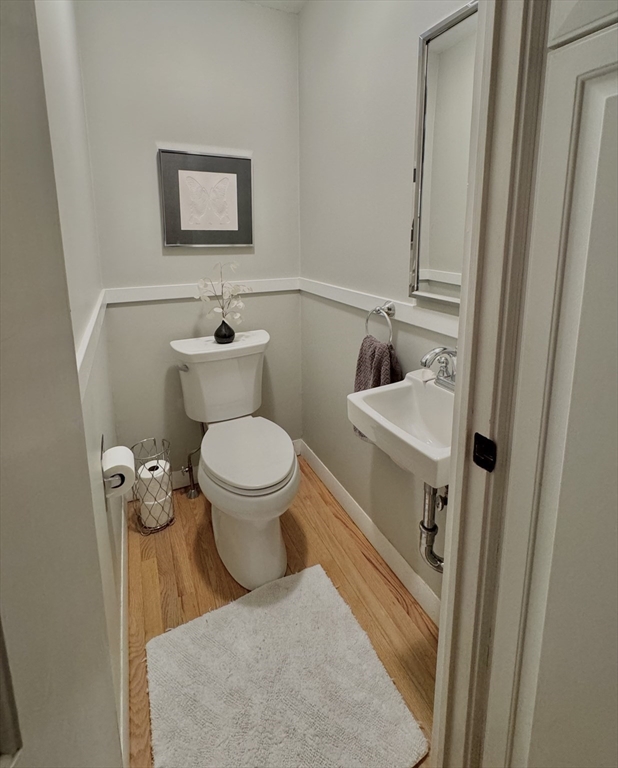 16 Evans Road Needham, MA 02492 - Photo 12 of 23 a bathroom with a toilet and a sink