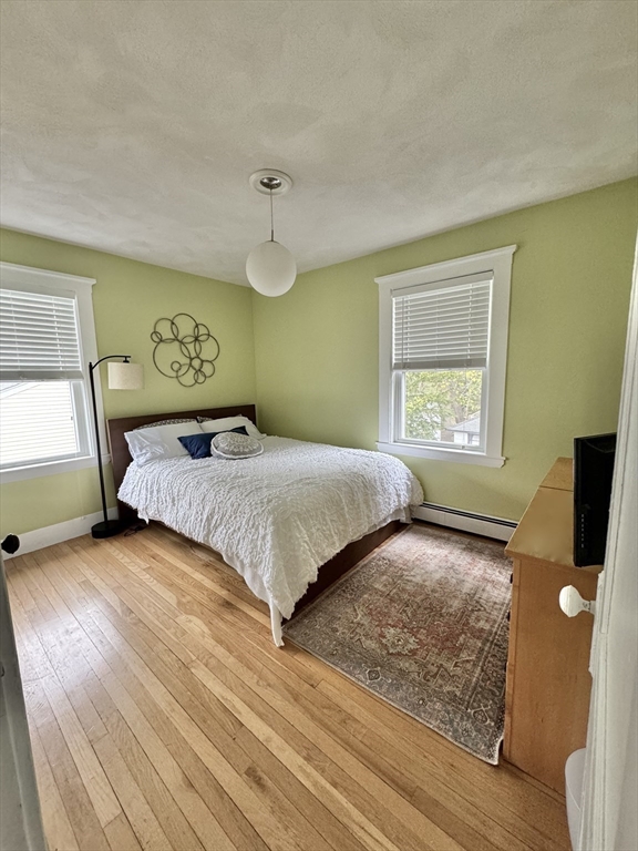 16 Evans Road Needham, MA 02492 - Photo 15 of 23 a bedroom with a bed and a window