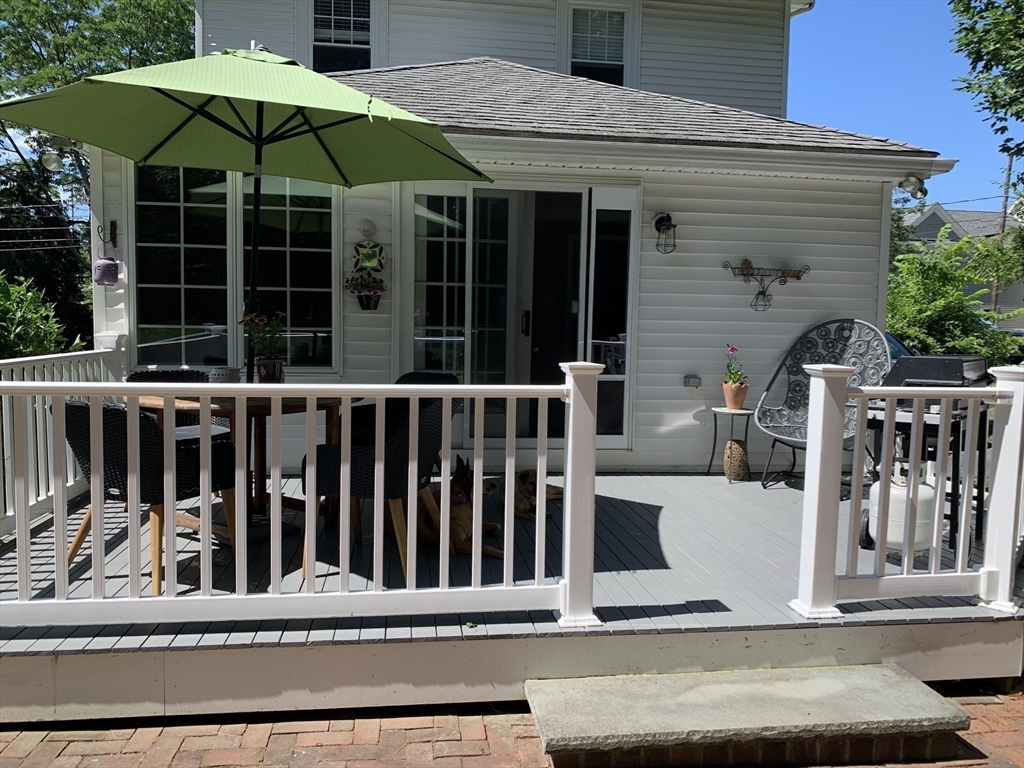 16 Evans Road Needham, MA 02492 - Photo 21 of 23 a view of a house with porch and wooden floor