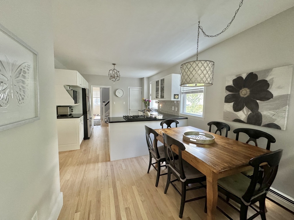 16 Evans Road Needham, MA 02492 - Photo 5 of 23 a view of a dining room with furniture and wooden floor
