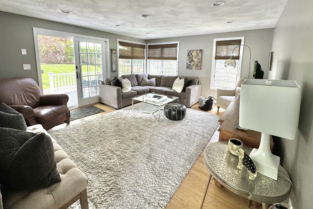 16 Evans Road Needham, MA 02492 - Photo 6 of 23 a living room with furniture and a large window