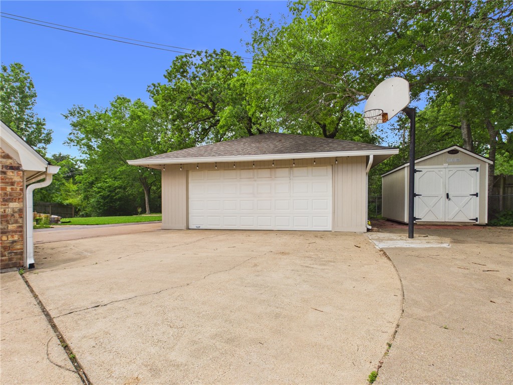 902 Briar Bend Court Bryan, TX 77802 - Photo 35 of 39 a house with trees in the background