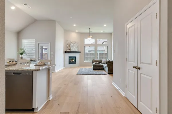 a open kitchen with sink and cabinets