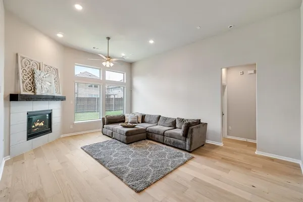a living room with furniture window and a fireplace