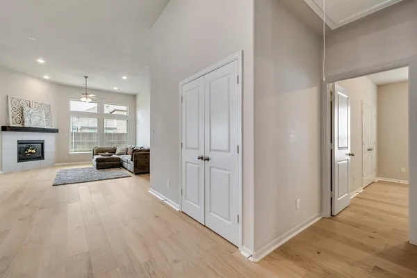 a view of a livingroom with furniture a flat screen tv and staircase