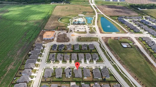 an aerial view of a house with outdoor space