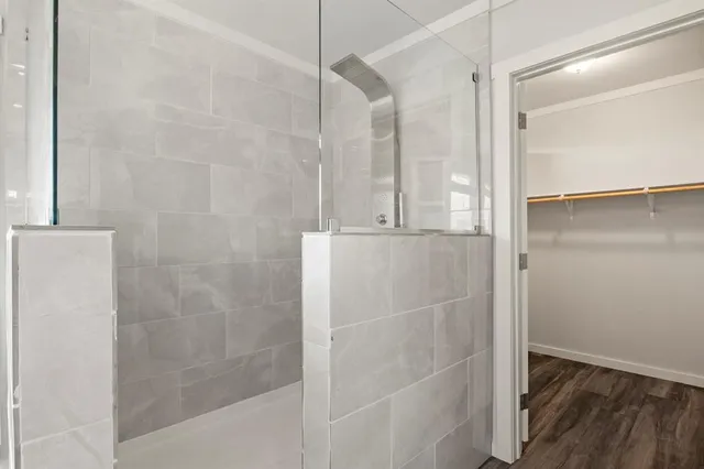 a bathroom with a glass shower door