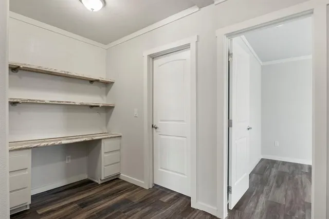 a storage room with wooden floor